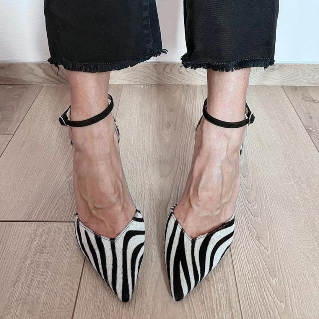 High-heeled shoes with zebra print and ankle strap